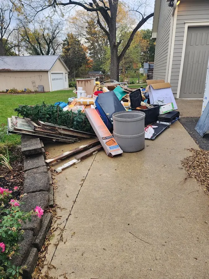 Dumpster being loaded with debris for Residential Dumpster Rental in Bedford Heights